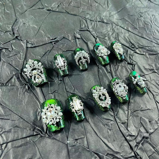 MellowBells palace-style green cat-eye press-on nails for quick at-home manicure.