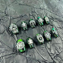 MellowBells palace-style green cat-eye press-on nails for quick at-home manicure.