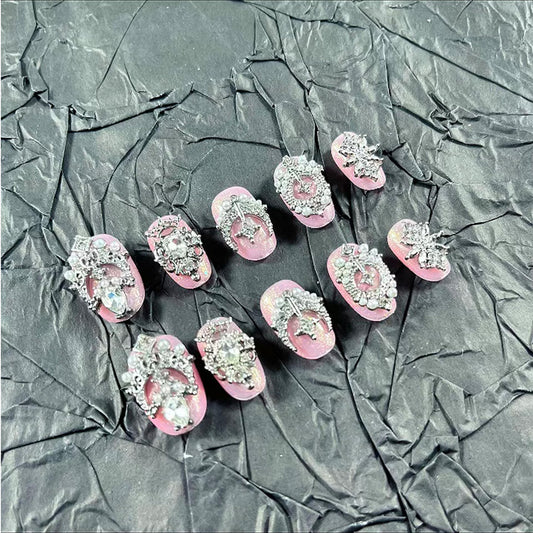 MellowBells palace-style pink cat eye nails glow with chic sparkle.