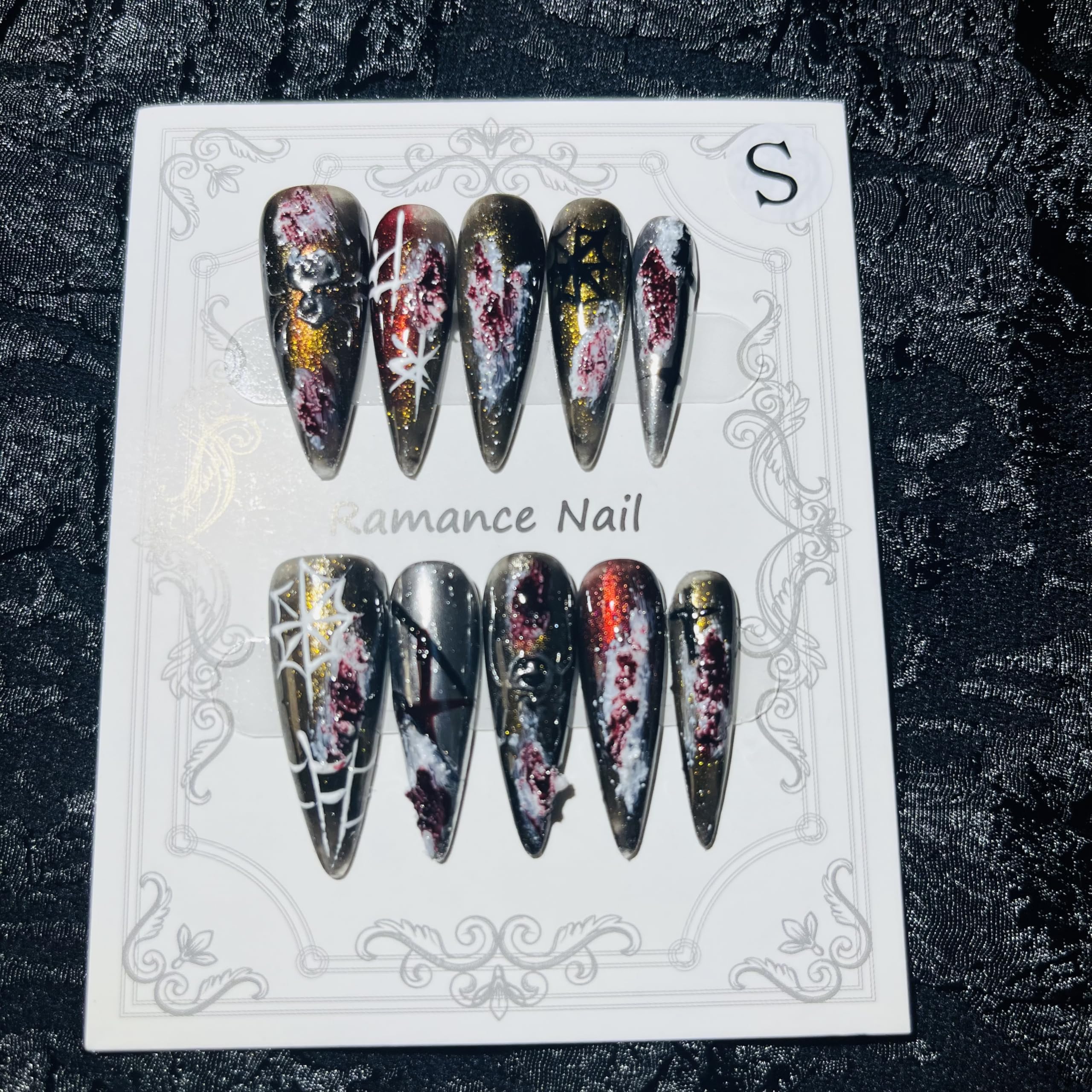 MellowBells Gothic press-on nails with dark accents for a bold party look