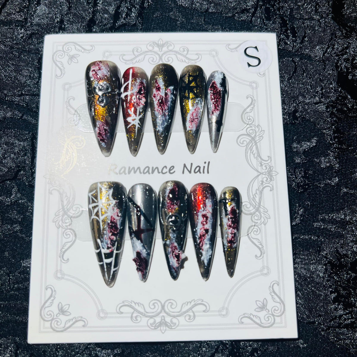 MellowBells Gothic press-on nails with dark accents for a bold party look