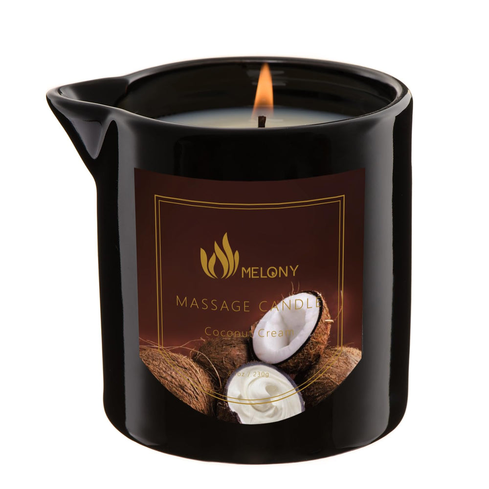 MELONY Coconut Cream Massage Candle in clear jar with lit wick
