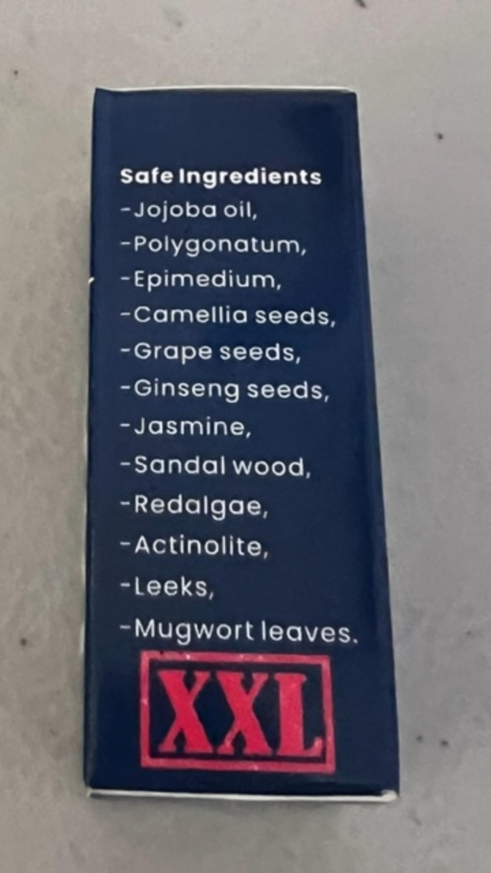 Close-up of dropper dispensing the massage oil