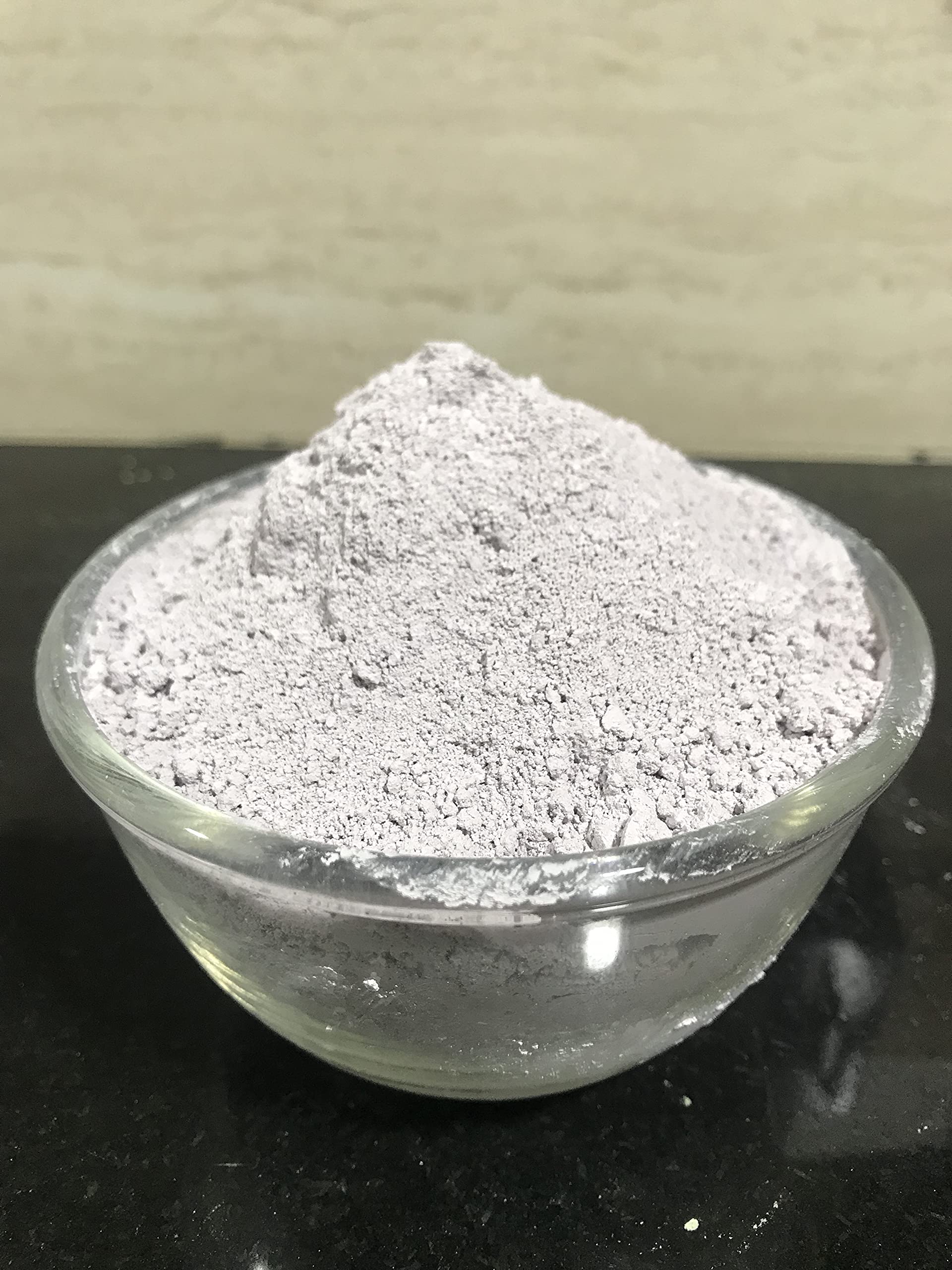 mGanna purple clay powder being mixed for a DIY face mask