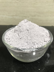 mGanna purple clay powder being mixed for a DIY face mask