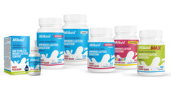 Person taking Milkaid chewables before a dairy meal