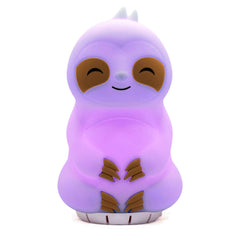 Mindsight Breathing Buddha on a desk in a cozy scene promotes calm breathing