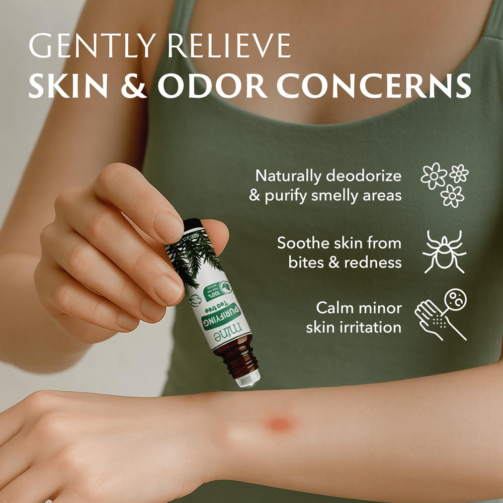 Tea tree leaves and essential oil bottle