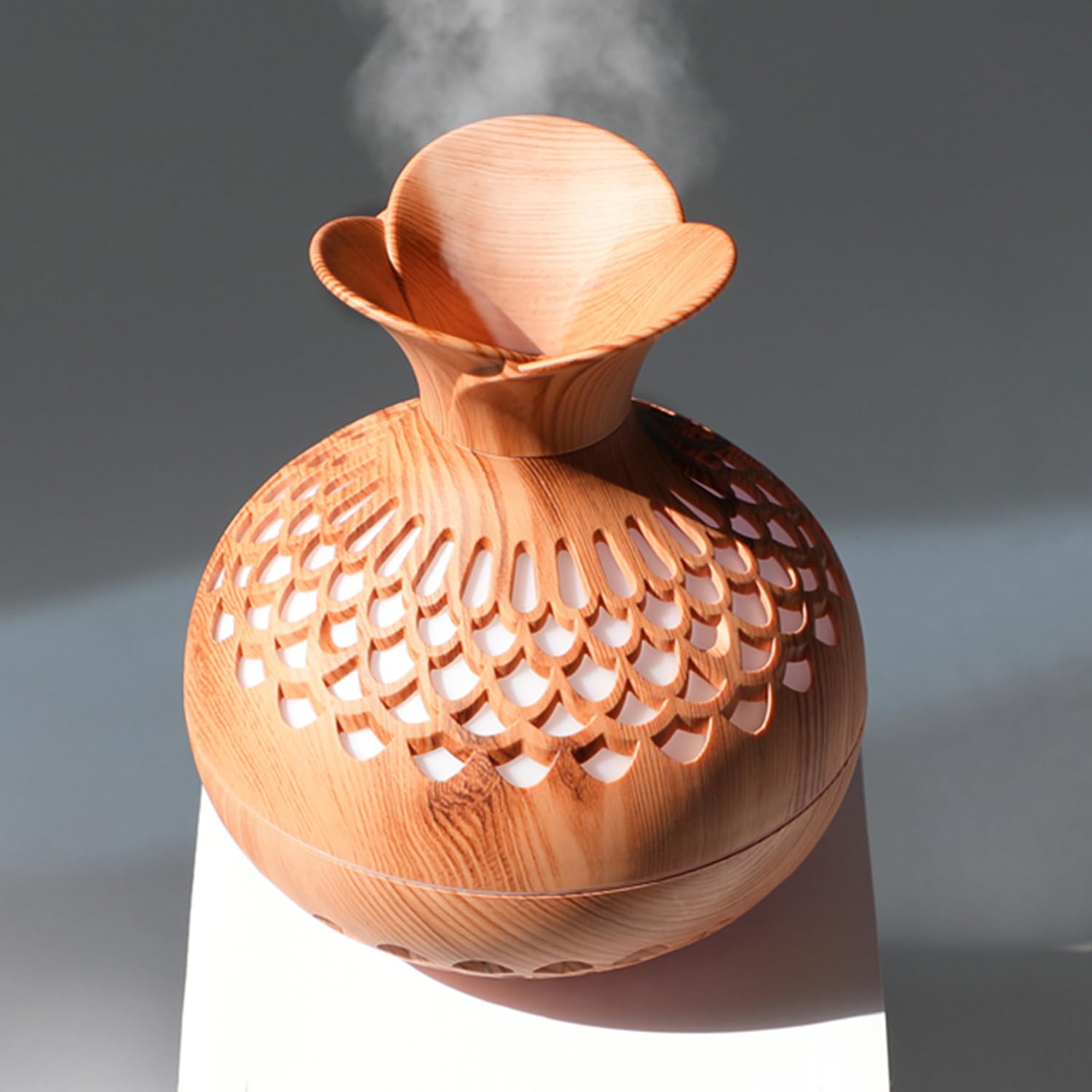 Compact 300ml mini humidifier on a desk with color LED night light