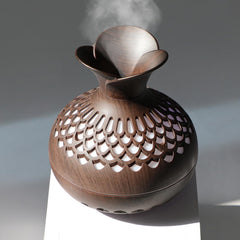Mini humidifier on a desk with colorful LED lights
