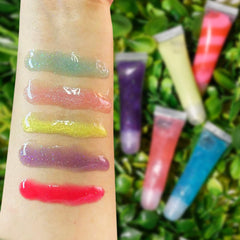 M&U Glitter lip gloss close-up swirl showing moisturizing shine.