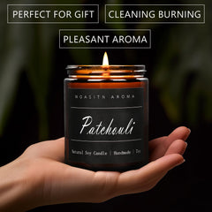 Close-up of MOASITN patchouli-scented candle in an amber jar