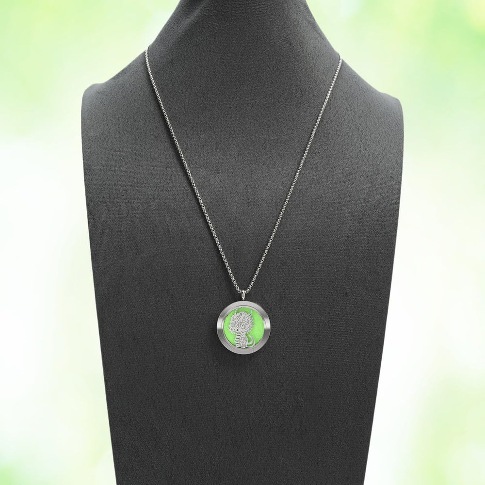 Person wearing the dinosaur aromatherapy diffuser necklace during yoga
