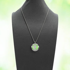Person wearing the dinosaur aromatherapy diffuser necklace during yoga