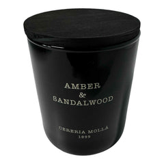 Molla 1899 handmade candle with amber-sandalwood glow for cozy, inviting spaces.