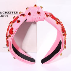 MOLOCH crystal pink top knot headband adds subtle sparkle