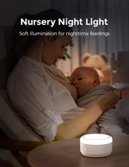 Baby sleep setup with Momcozy sound machine in a dim nursery