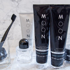 Family using MOON toothpaste for daily oral care