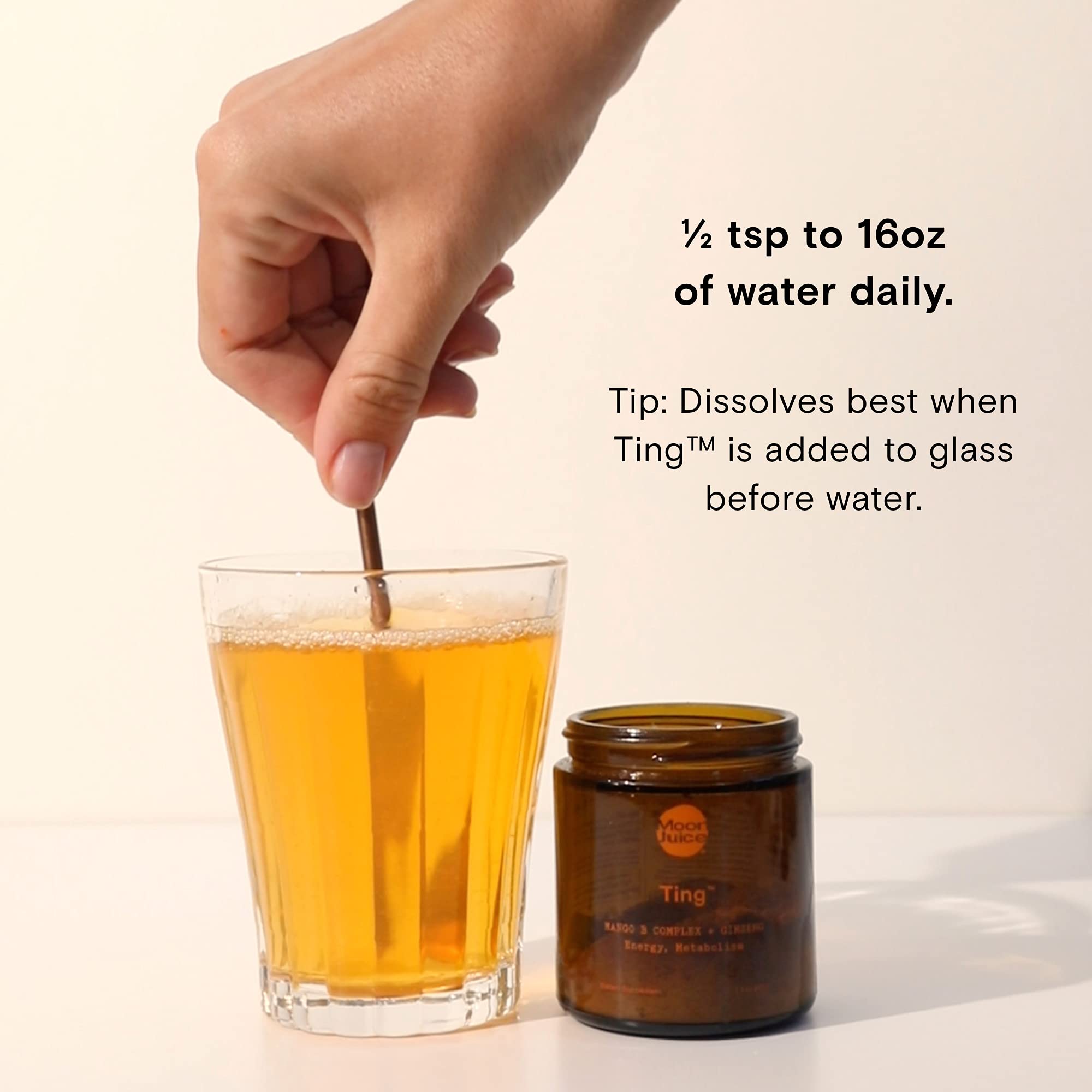 Dissolving Ting Mango B Complex in water with mango flavor