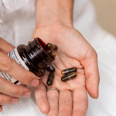Motherlove More Milk Moringa capsules close-up reveals four-ingredient herbal blend