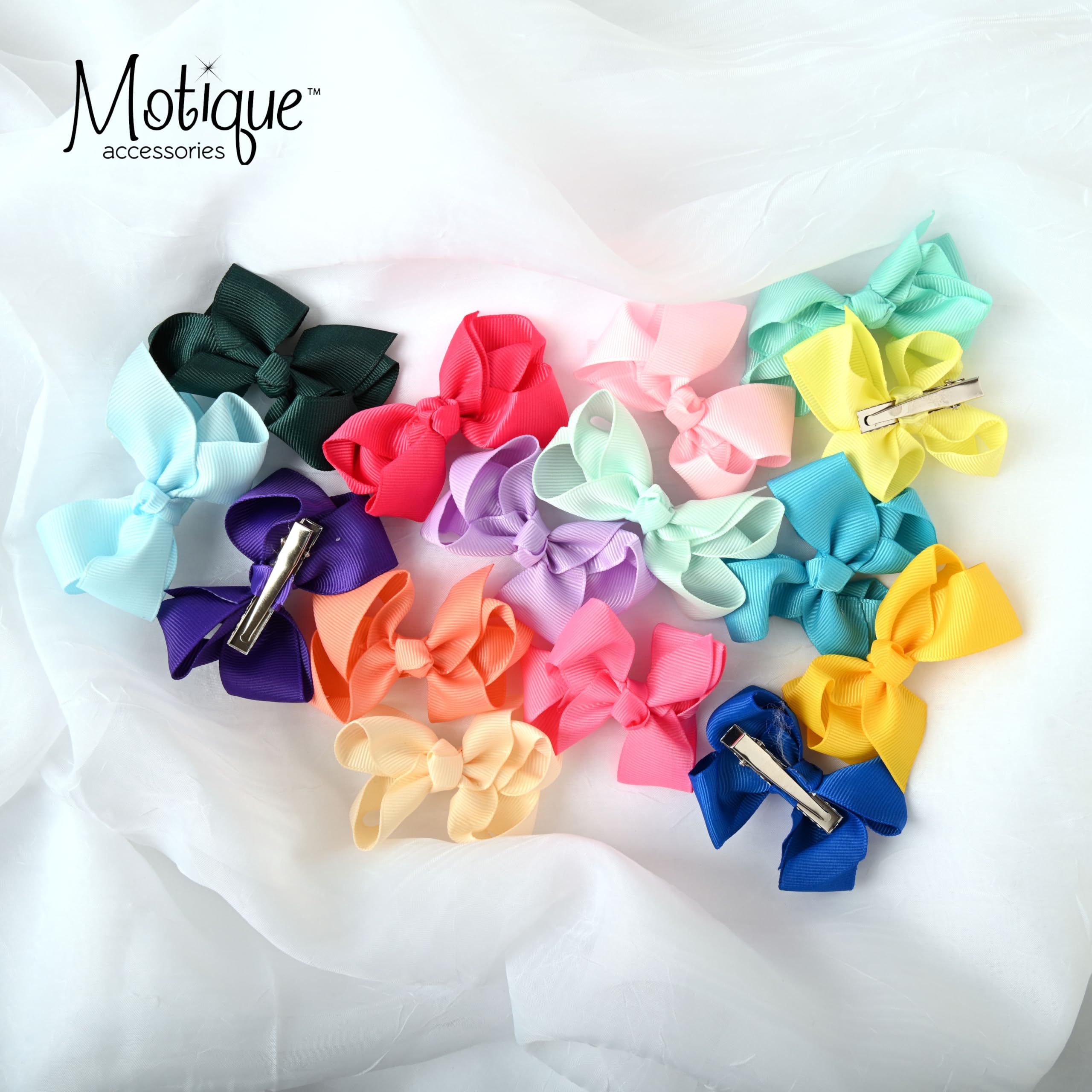 Motique grosgrain red bow on a 3-inch clip for polished hairstyles.