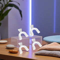 Set of four mouth guards laid out side by side