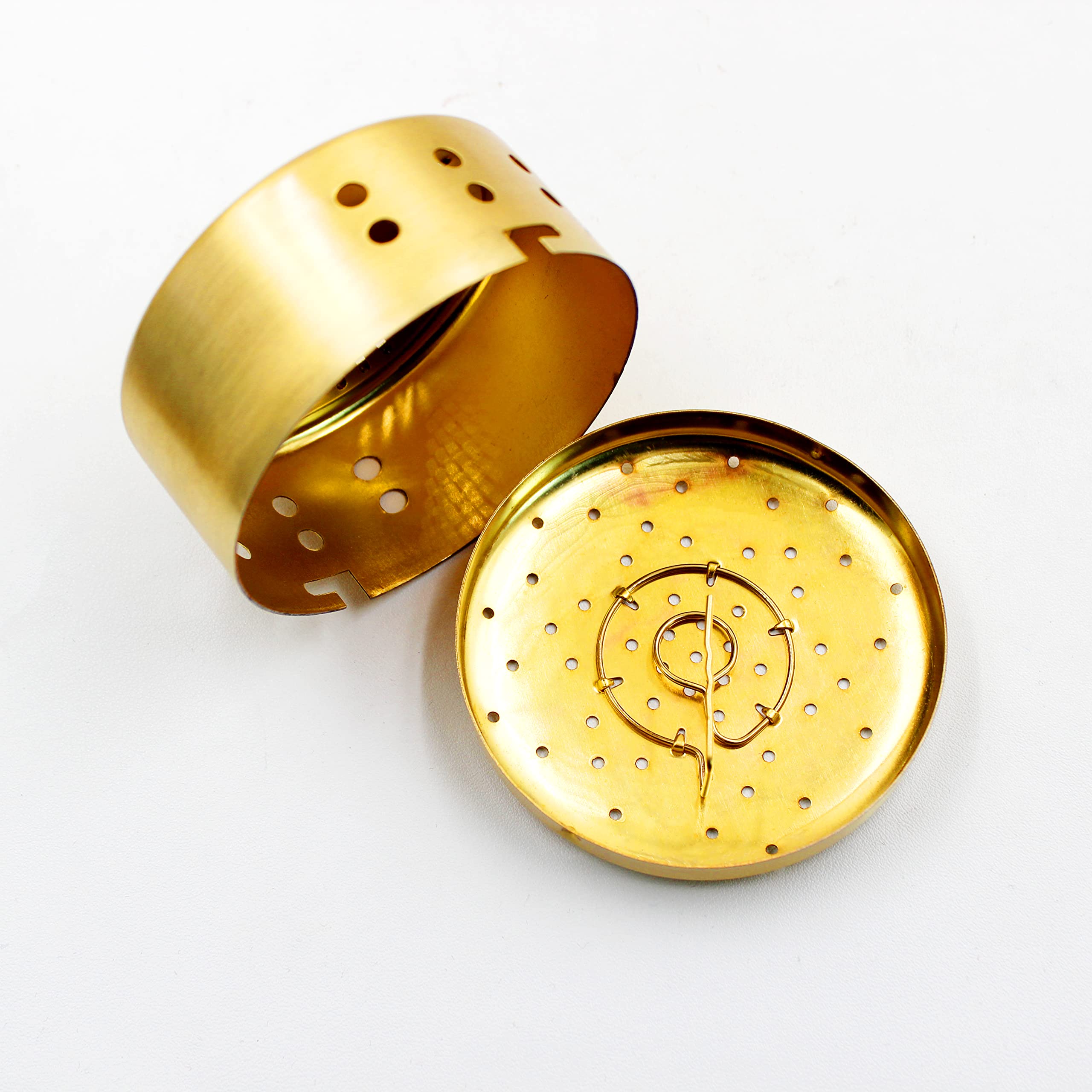 Top view of copper burner box showing air holes