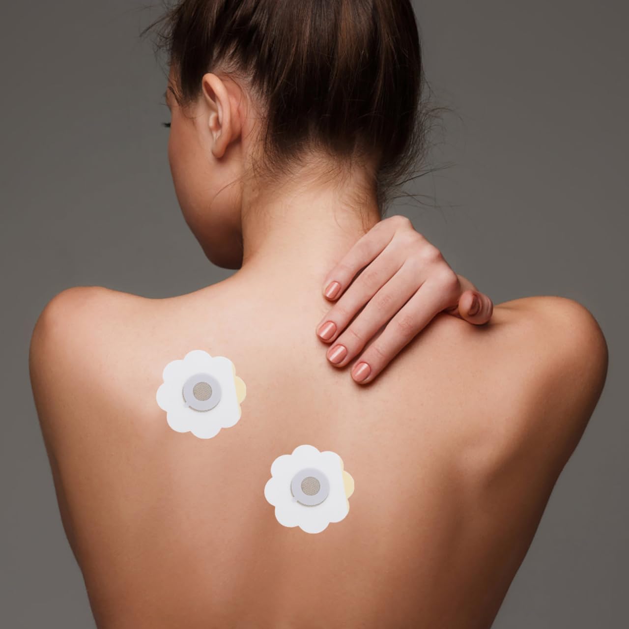 Close-up of white moxibustion sticker patch on skin