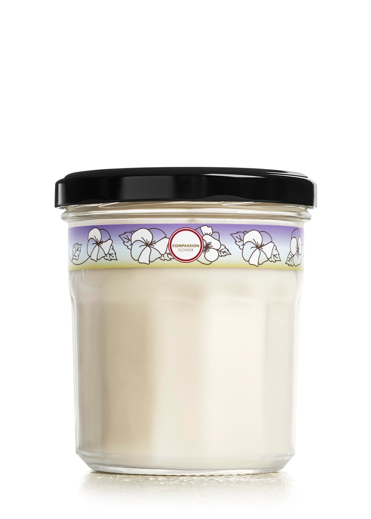 Mrs. Meyer's Clean Day Compassion Flower candle jar for long-lasting room fragrance.