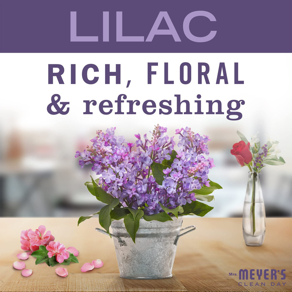 Lit lilac tin candle with 12-hour burn time and lead-free wick