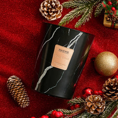 Close-up of the 35oz Oud Wood candle showing three lead-free wicks