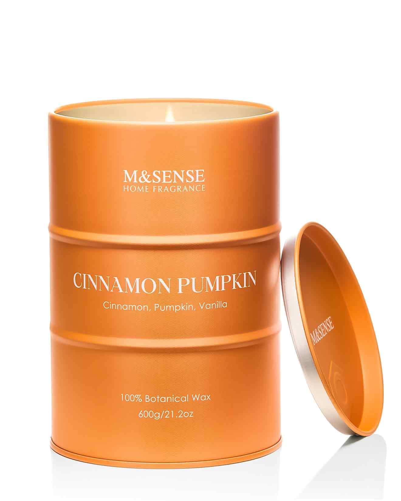 Close-up of M&SENSE Cinnamon Pumpkin scented candle in glass tin