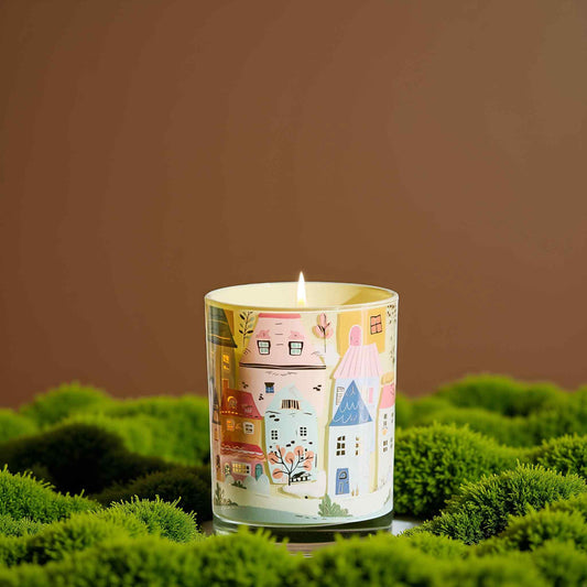 CharmArch hand-drawn townscape close-up on candle surface