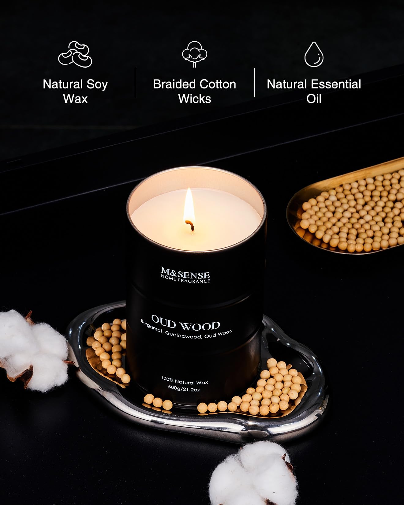 Oud Wood candle burning with steady flame