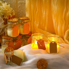 Close-up of a glass jar candle with kraft label and DIY tag