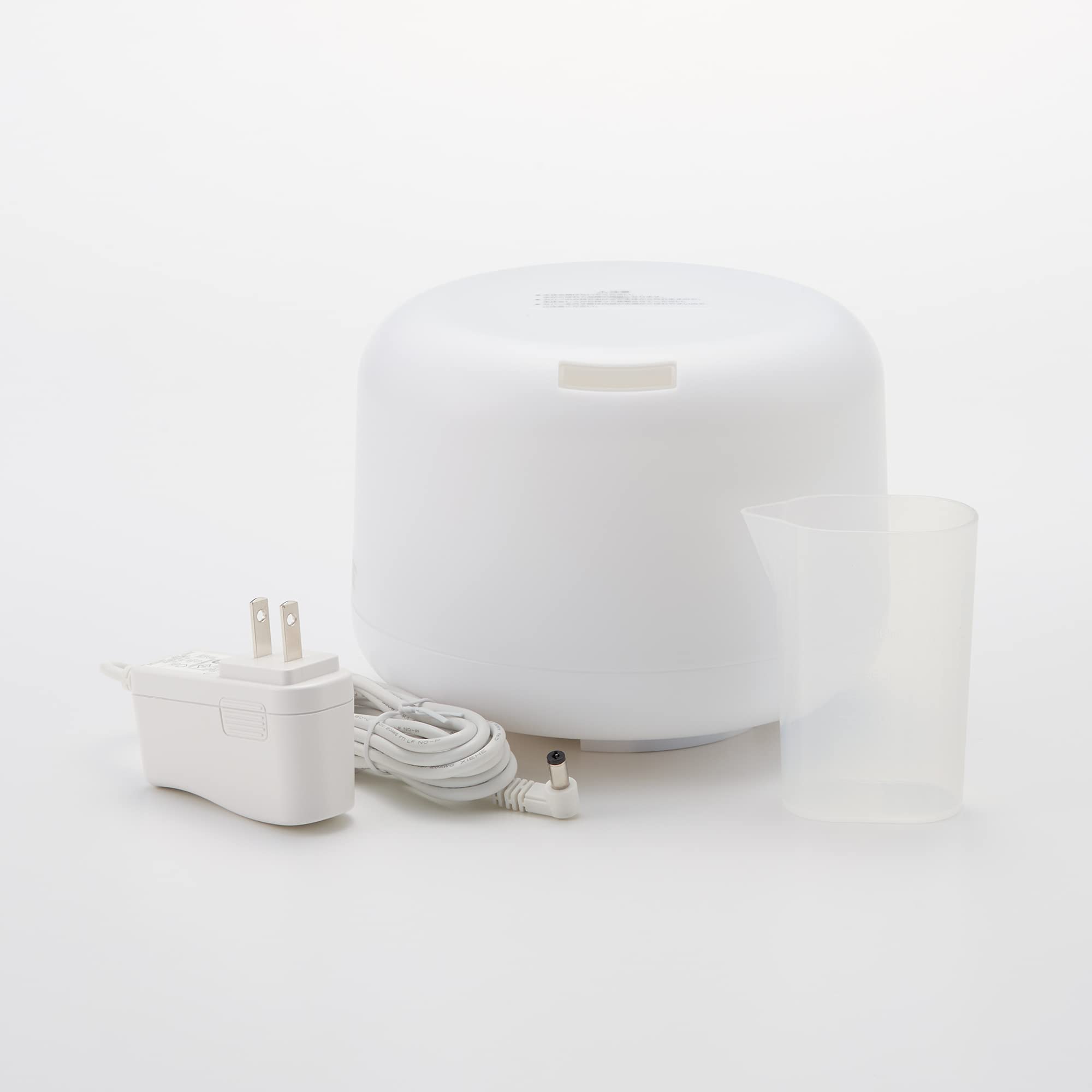 Muji MJ-UAD1 diffuser side view with soft ambient glow for night ambience