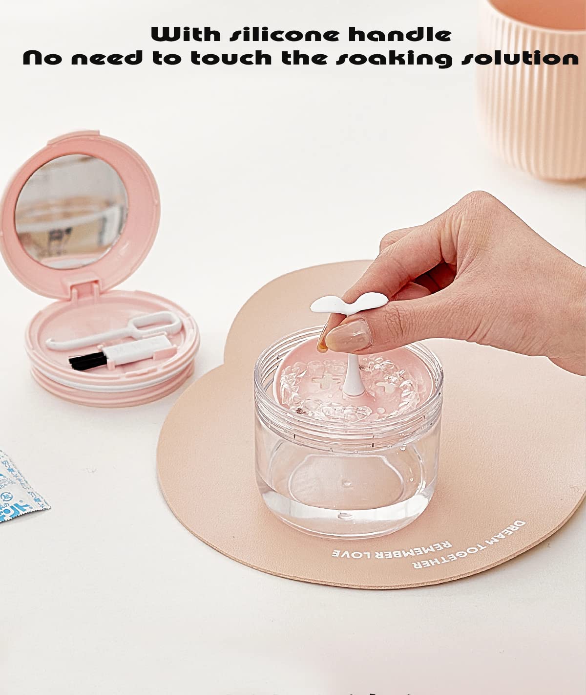 Extractor and brush included with pink denture case