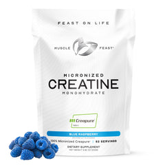 Muscle Feast Creapure blue raspberry tub ready for workouts.