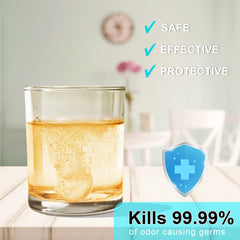 Denture cleaning tablets dissolving in water in a cup