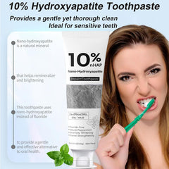 Person brushing teeth with fluoride-free toothpaste