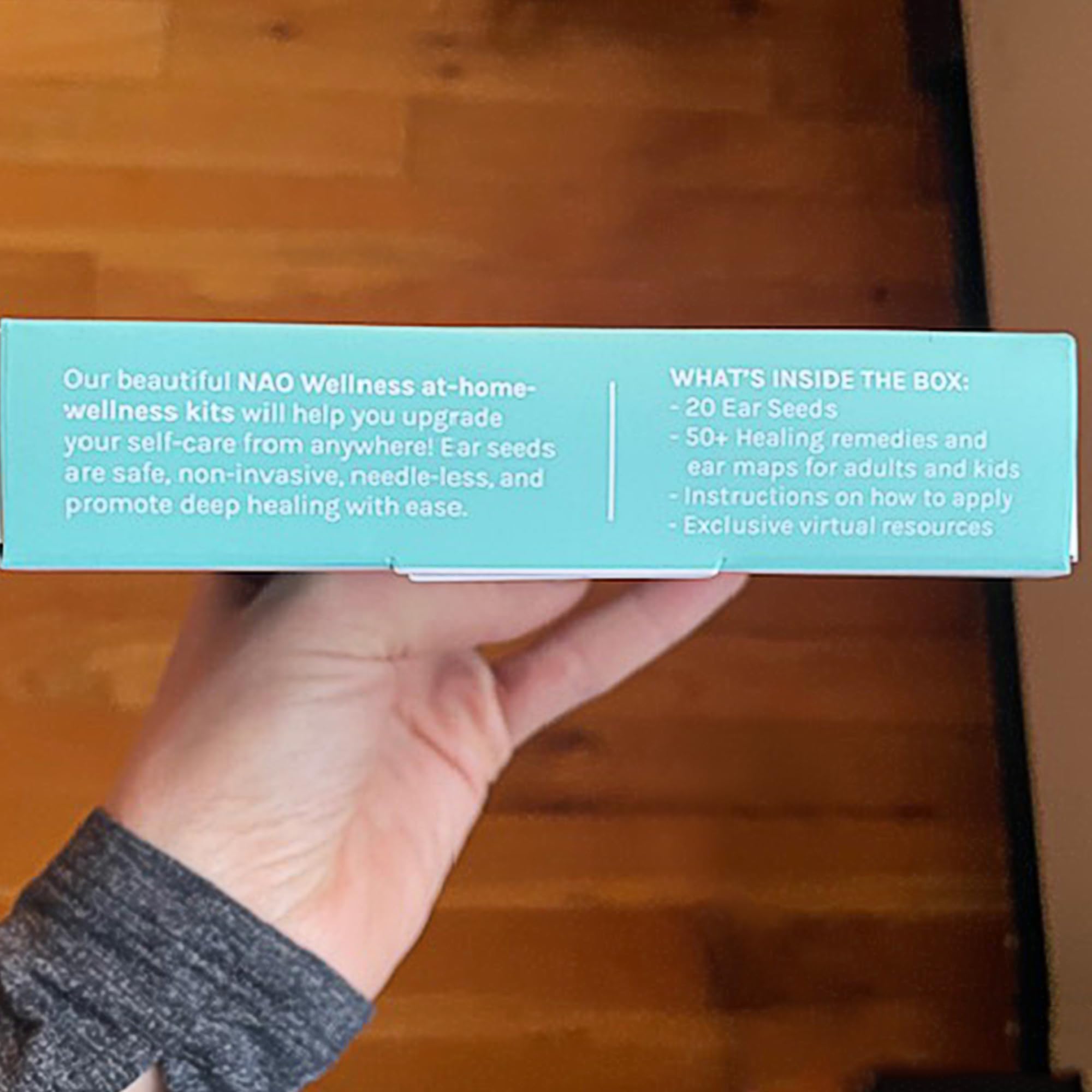 Packaging and product visuals of NAO Wellness ear seeds kit