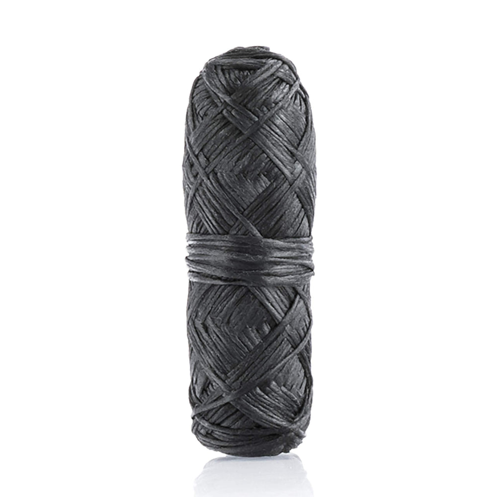 Lifestyle shot of person flossing with bamboo charcoal floss