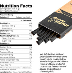 Close-up of Shilajit resin and raw honey in a honey stick