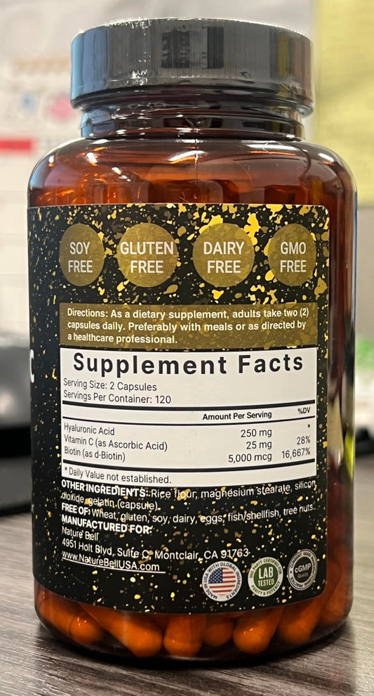 Close-up of NatureBell bottle label showing 3-in-1 formula with biotin and vitamin C