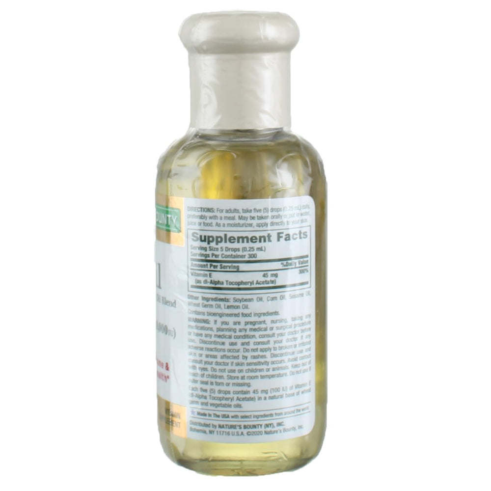 Close-up of Nature's Bounty Vitamin E-Oil 30,000 IU bottles in a 3-pack (image 2)