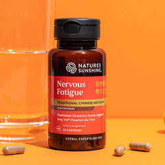 Bottle and capsules in display for Nature's Sunshine product
