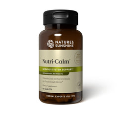 Nature's Sunshine Nutri-Calm bottle on desk supports daily nervous system balance.