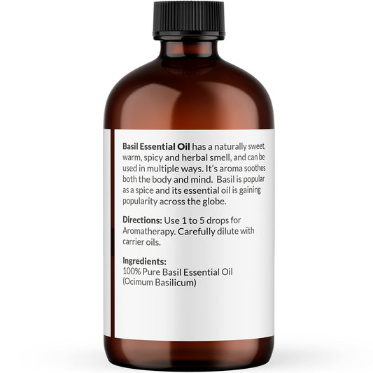 Amber glass bottle of NaturoBliss Basil essential oil with dropper