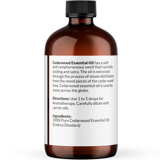 Amber glass bottle of NaturoBliss Cedarwood essential oil with dropper