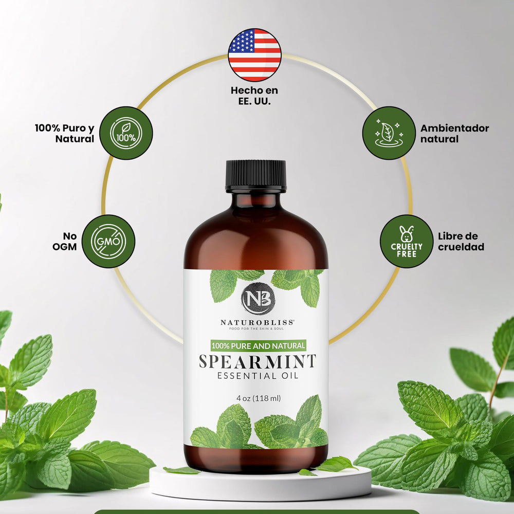 Fresh spearmint leaves with bottle